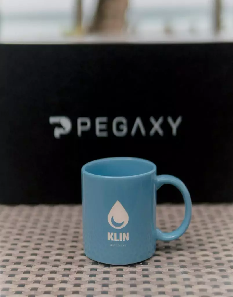 A blue Klin mug from the merch box